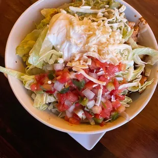 a bowl of salad on a table