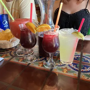 people sitting at a table with drinks