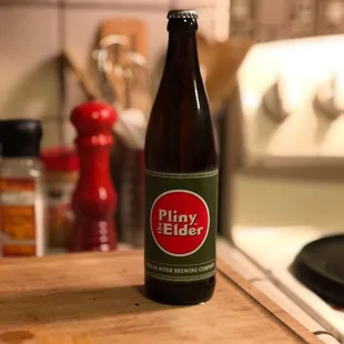 a closeup of a beer bottle on a kitchen counter