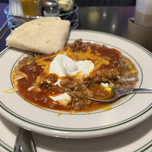 a plate of chili and cheese