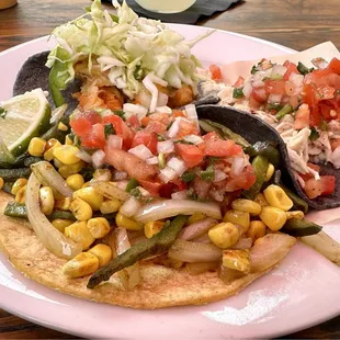 Top notch taco trio: veggie, shredded chicken, and codfish.