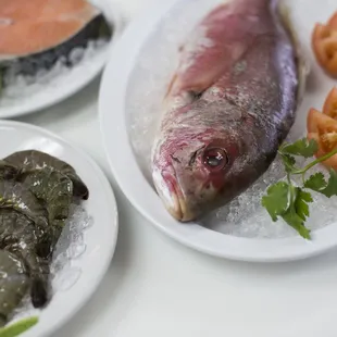 three plates of fish and vegetables