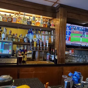 a bar with a television in the background