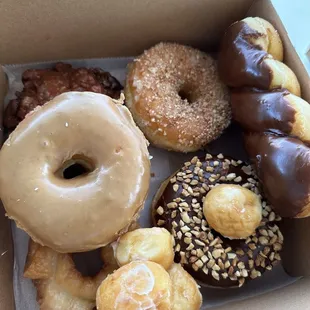 Half dozen - apple fritter, crumb, chocolate twist, maple ring, old fashioned glazed, choc ring w/ peanuts.