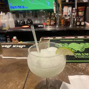 a margarita with a lime slice in it