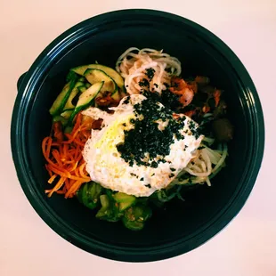 an overhead view of a bowl of food
