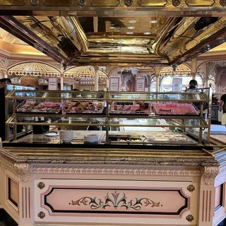 Variety of Muffins, Croissants, Danish, and Fruit