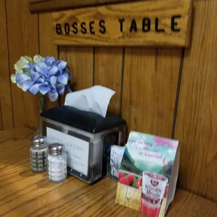 a table with napkins, napkins, and spoons