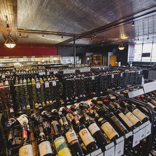 rows of wine bottles in a store