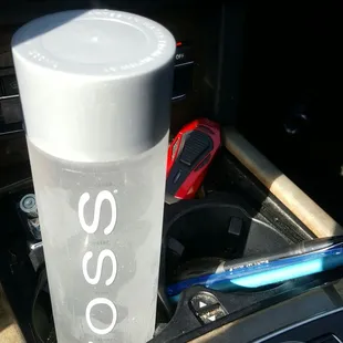 a cup in the center console of a car
