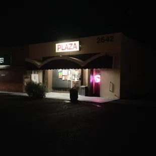 the outside of a restaurant at night