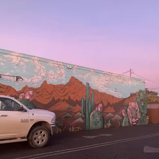 Gorgeous mural on the side of the building. Fun to look at while waiting for your booze!