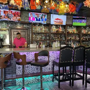 two men sitting at the bar