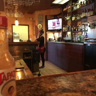 a woman sitting at a bar