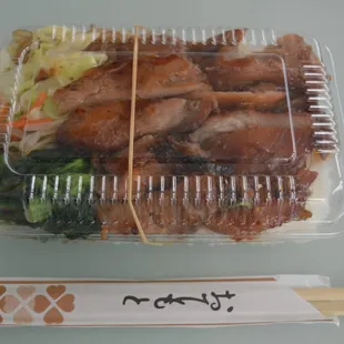Teriyaki Chicken Bento.  Bentos come with sides of greens, bean sprouts, and rice noodles, which make things even better!