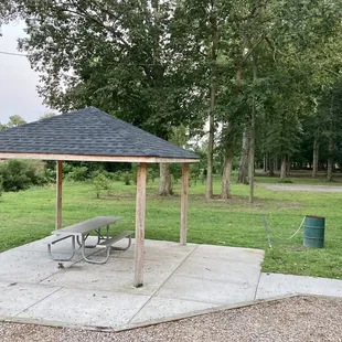 Closer view of the picnic pavilion and trash can