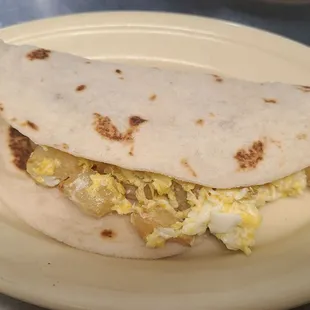 a tortilla with scrambled eggs