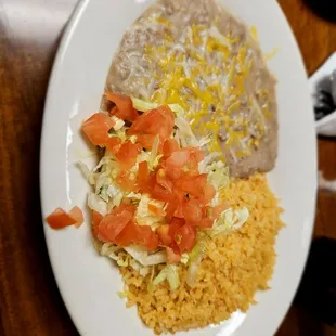 Refried beans and rice, served with the fajitas