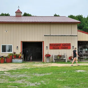 a woman walking in front of a building