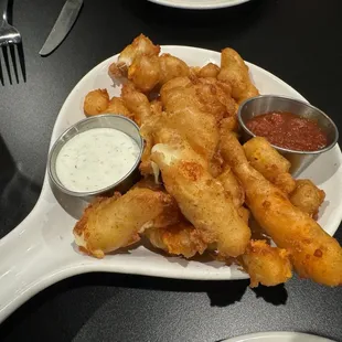 Cheese curds in yellow and white cheese.
