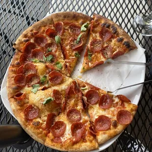 a pepperoni pizza on a plate