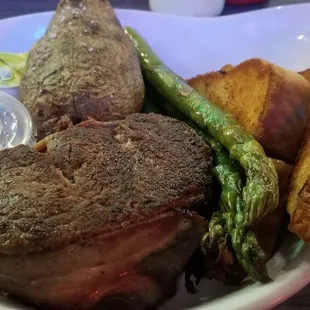 Bacon wrapped First Mignon, baked potato,  asparagus,  texas toast. Lots of food for the price
