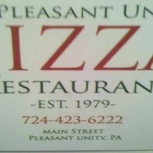 a sign for pleasant unity pizza and restaurant