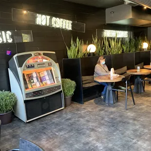 a man sitting at a table in a restaurant