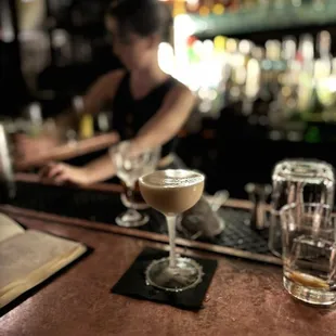 a woman sitting at a bar
