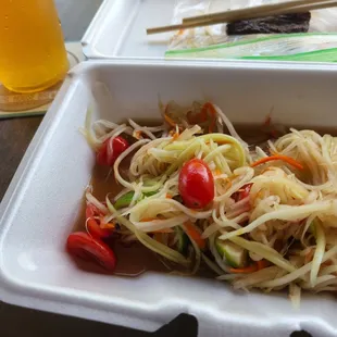 a salad in a styrofoam container