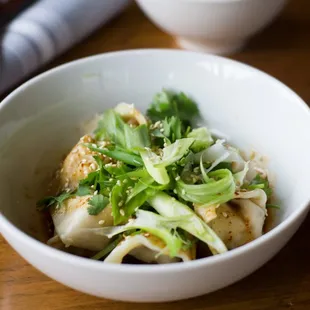 Pork dumplings with chili oil.