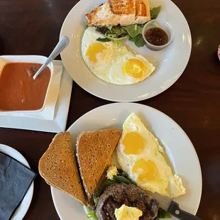 Filet mignon with eggs and toast and Salmon Filet with eggs and a bowl of tomato Cup of Soup