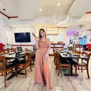 a woman standing in a restaurant