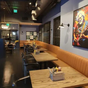 a dining area with tables and chairs