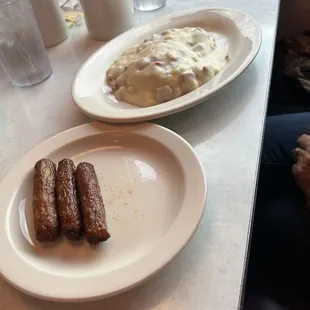 Sausages and chipped beef over biscuits