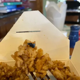 a fork in a box of food