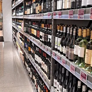 rows of bottles of wine on shelves