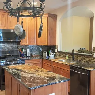 a kitchen with granite counter tops