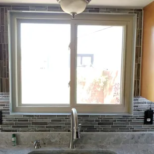a kitchen sink and window