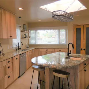 a kitchen with granite counter tops