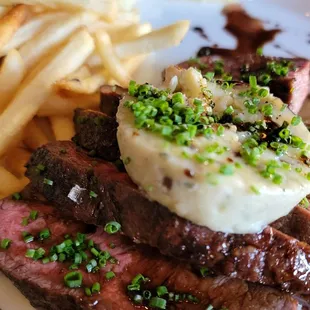 Steak with blue butter melt and fries. Perfectly cooked.