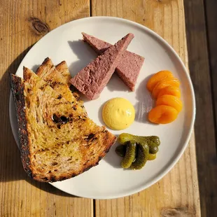 a plate of food on a wooden table