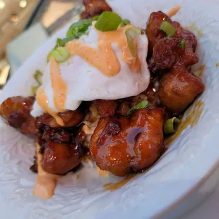 Teriyaki chicken karaage topped with an egg, steamed rice &amp; spicy mayo