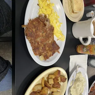 Corned beef hash, eggs, home fries, and biscuit