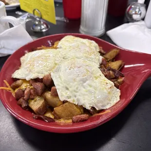 Jumbo skillet with eggs over medium, I ordered sausage gravy on the side to pour over this bad boy = highly recommended