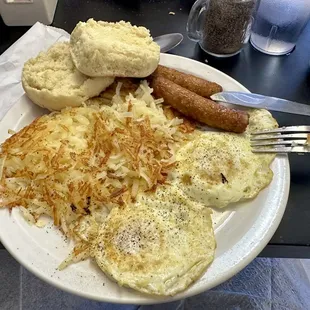 Two over medium eggs with hash browns prepared perfectly.