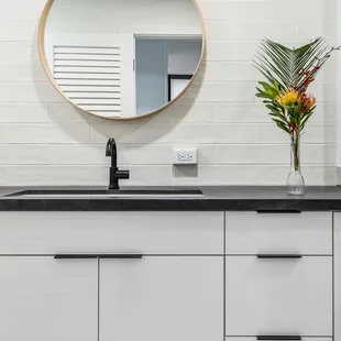 Custom bathroom vanity in white high gloss finish. Locally designed and manufactured in Kapolei, HI.