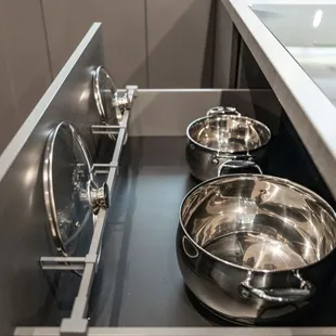 Drawer organizers to keep pots and pans organized and easily accessible.