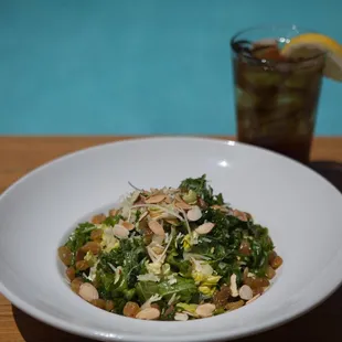 Signature Kale Salad with toasted quinoa, grana padano parmesa, toasted almonds, lemon olive oil vinaigrette