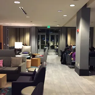 Empty lobby seating area with direct view to the restaurant dining area.